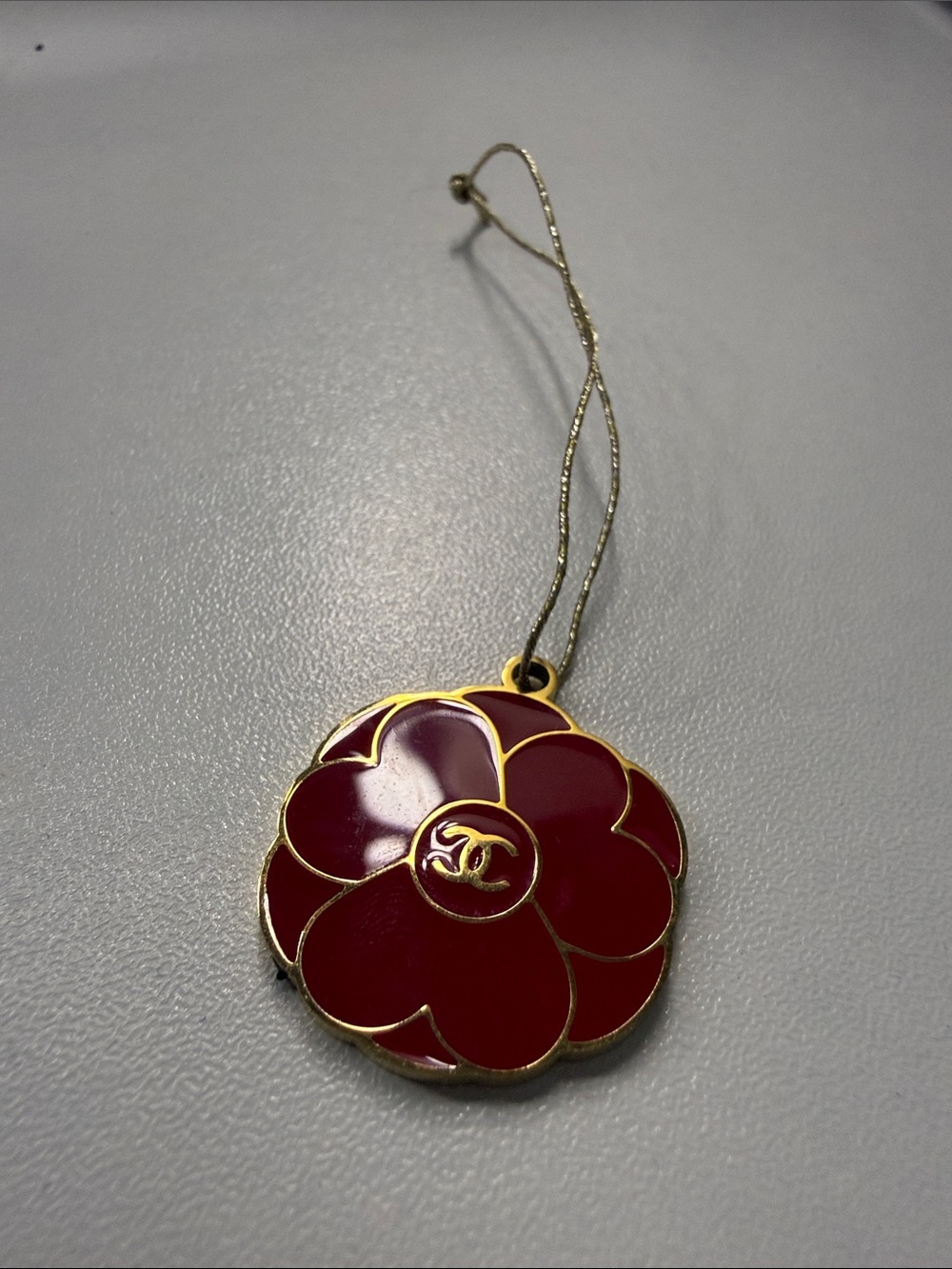 CHANEL Burgundy Enamel Camellia Keychain with Gold Trim